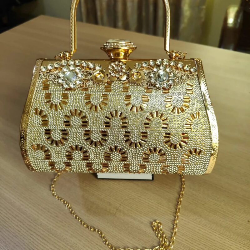 Golden color designed handbag with pearls